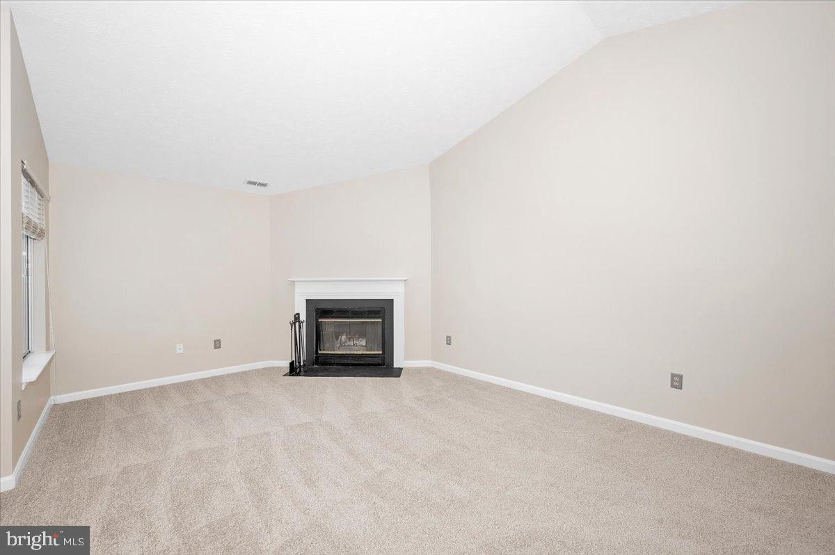 2129 Wainwright Court, Unit 2D Frederick, MD 21702 - Photo 14 of 57 Spacious living area with cozy fireplace.