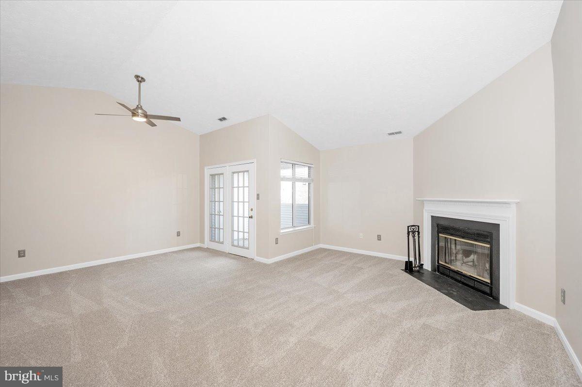 2129 Wainwright Court, Unit 2D Frederick, MD 21702 - Photo 15 of 57 Spacious living area with cozy fireplace.