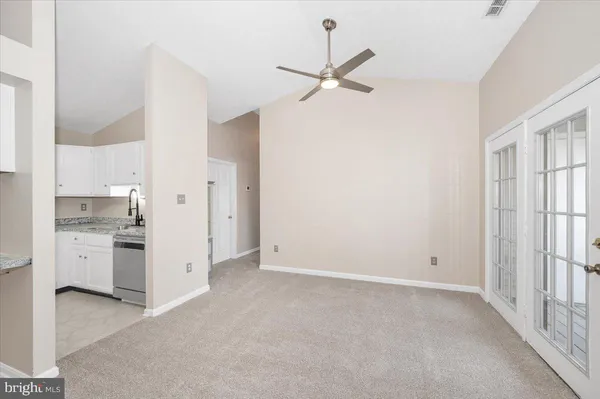 a kitchen with stainless steel appliances a stove microwave and cabinets