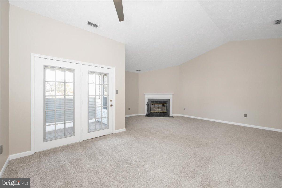 2129 Wainwright Court, Unit 2D Frederick, MD 21702 - Photo 22 of 57 Spacious living area with cozy fireplace.