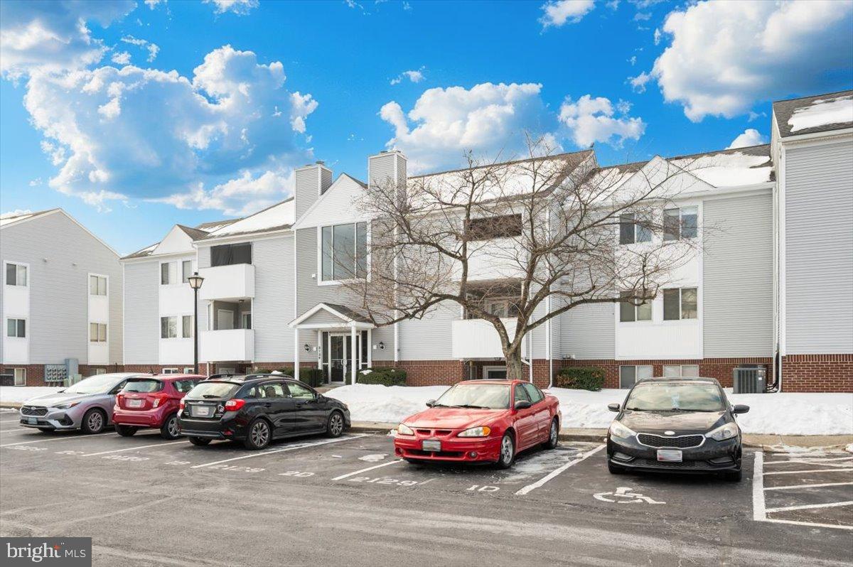 2129 Wainwright Court, Unit 2D Frederick, MD 21702 - Photo 48 of 57 Charming apartment complex under a blue sky.