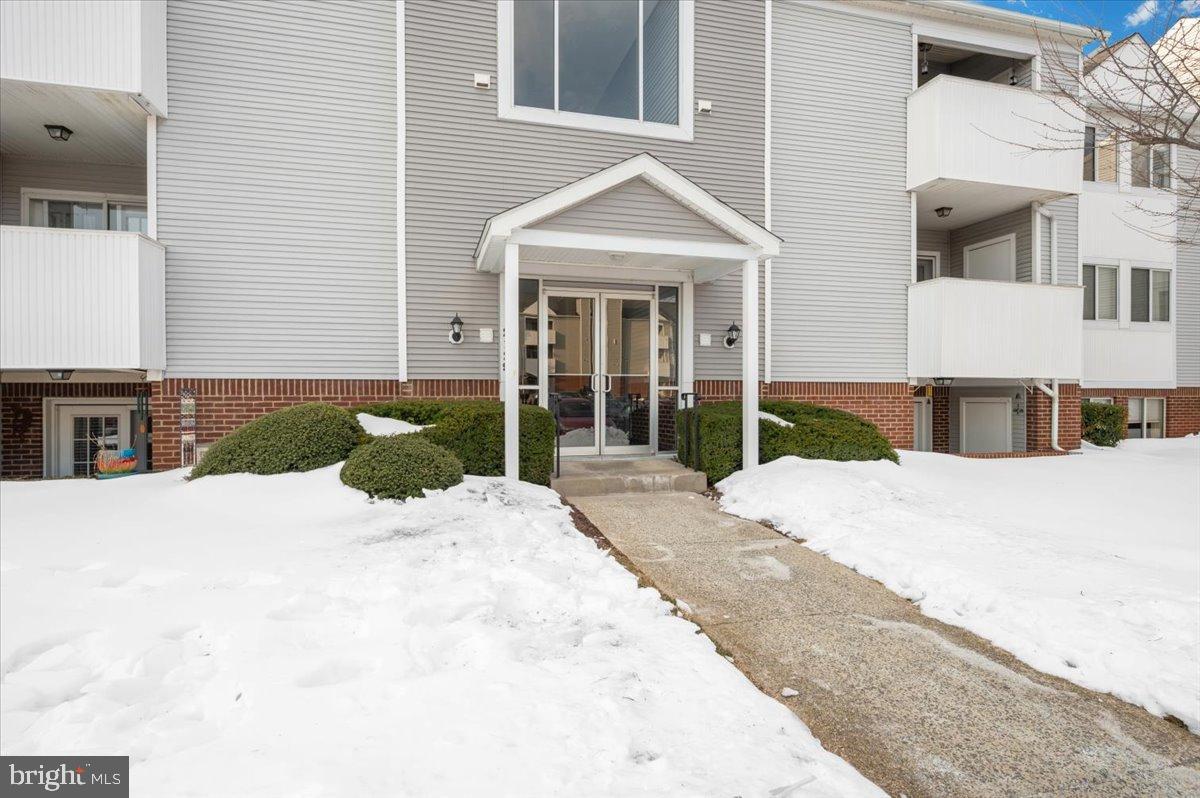 2129 Wainwright Court, Unit 2D Frederick, MD 21702 - Photo 50 of 57 Charming entrance framed by winter's touch.