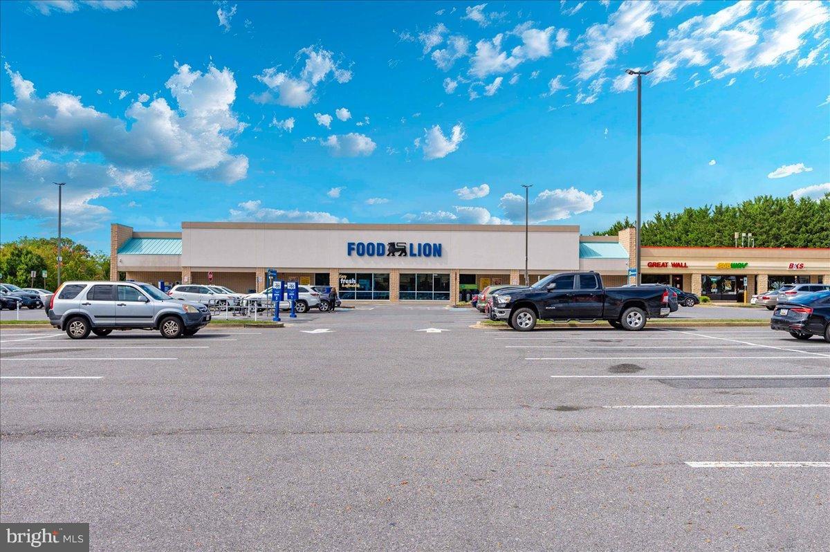 2129 Wainwright Court, Unit 2D Frederick, MD 21702 - Photo 53 of 57 Vibrant storefront under a bright sky.