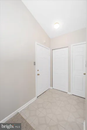 a view of a kitchen cabinets and empty room