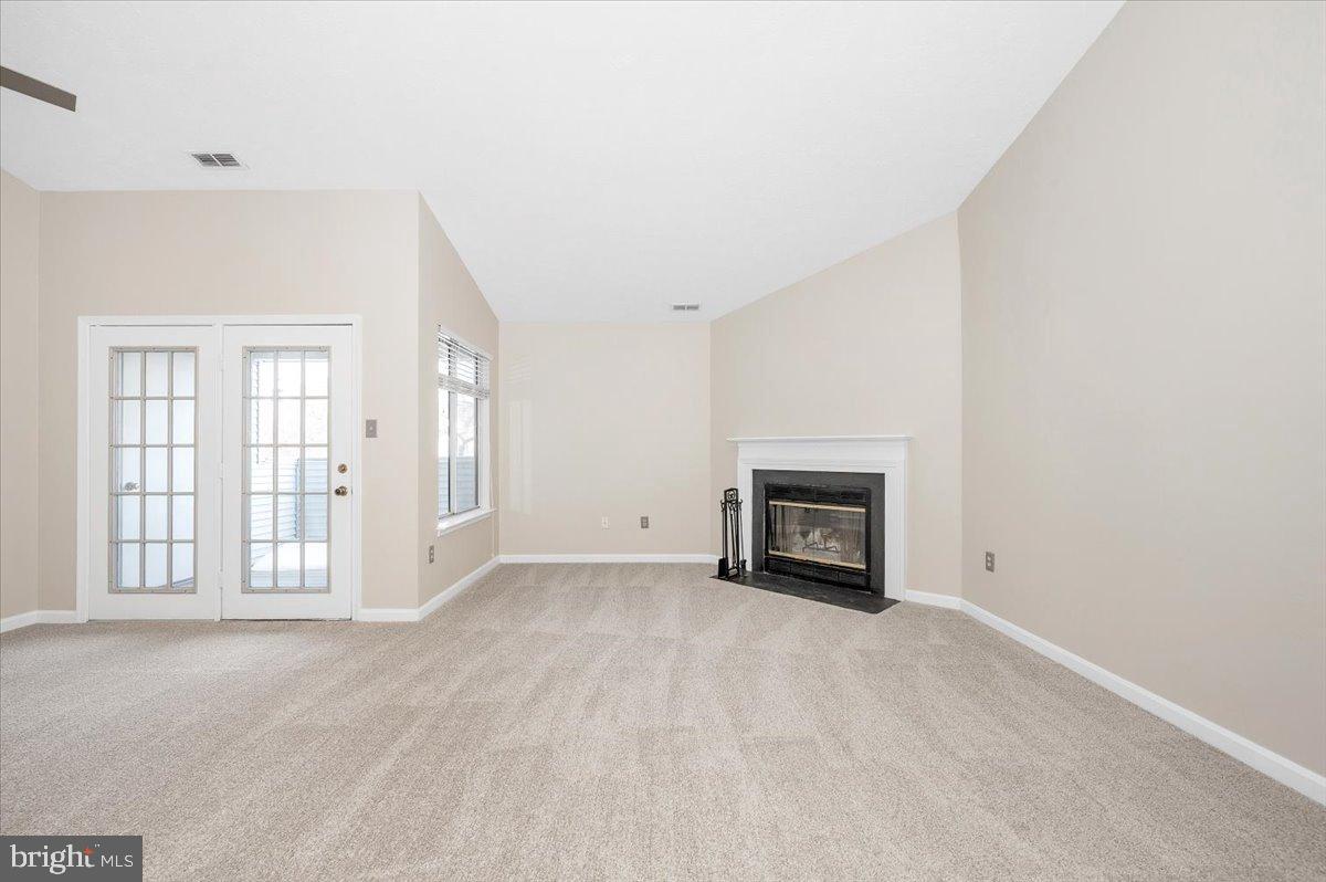 2129 Wainwright Court, Unit 2D Frederick, MD 21702 - Photo 6 of 57 Spacious living area with cozy fireplace.