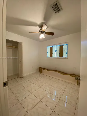 a view of an empty room and window