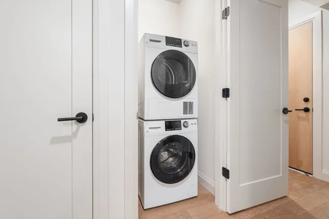 a close view of a utility room with dryer and washer