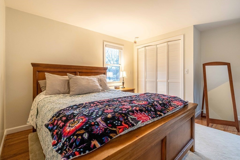 36 Sylvester Road Natick, MA 01760 - Photo 11 of 30 a bed sitting in a bedroom next to a window
