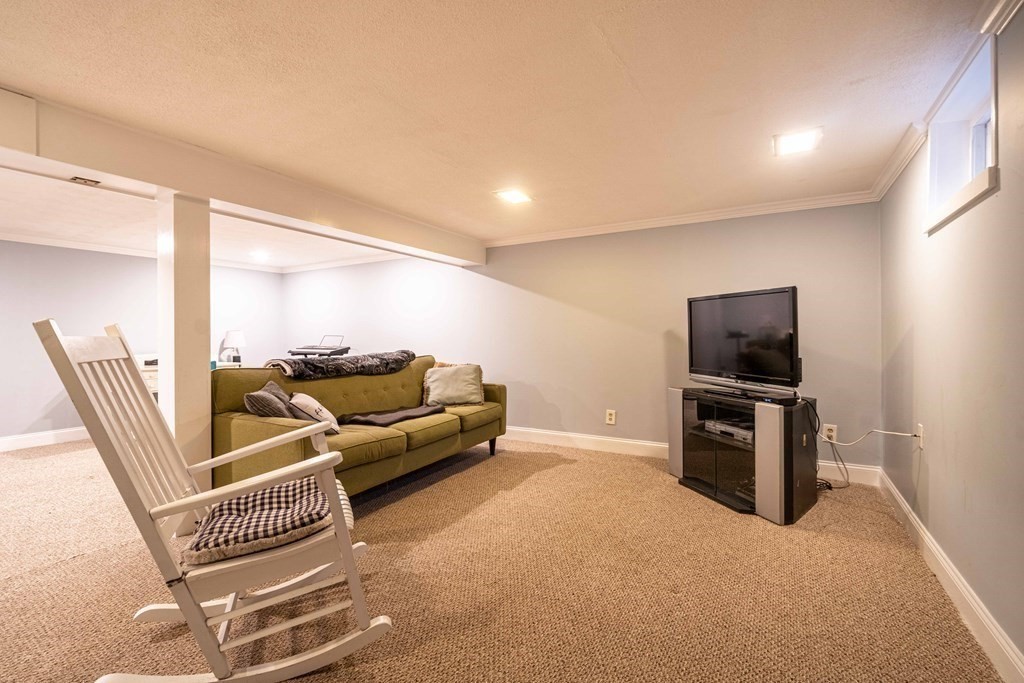 36 Sylvester Road Natick, MA 01760 - Photo 19 of 30 a living room with furniture and a flat screen tv