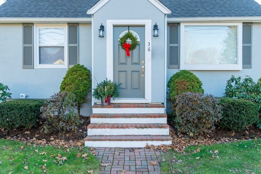 36 Sylvester Road Natick, MA 01760 - Photo 22 of 30 a front view of a house with a garden