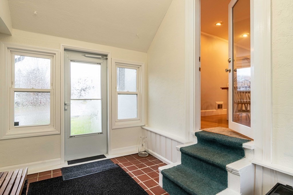 36 Sylvester Road Natick, MA 01760 - Photo 23 of 30 a view of an empty room with wooden floor and a window