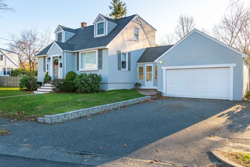 36 Sylvester Road Natick, MA 01760 - Photo 24 of 30 a front view of a house with a yard and garage