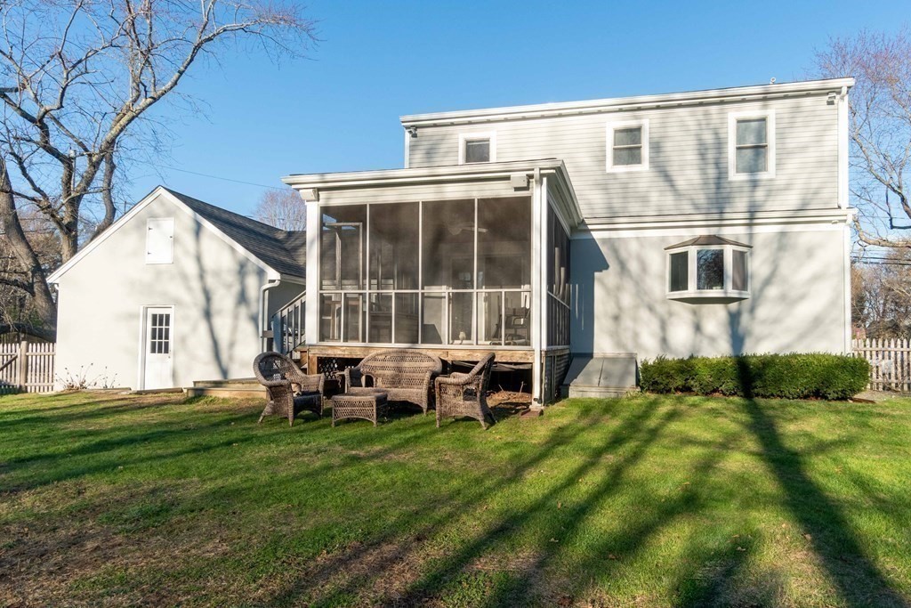 36 Sylvester Road Natick, MA 01760 - Photo 26 of 30 a backyard of a house with table and chairs