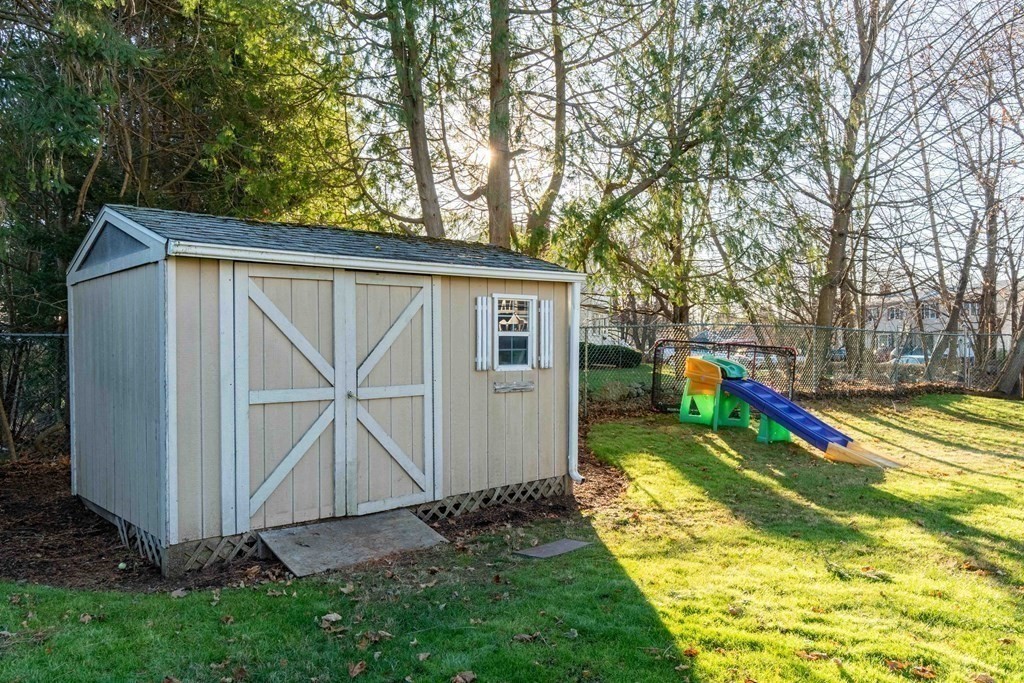 36 Sylvester Road Natick, MA 01760 - Photo 27 of 30 a view of a house with backyard and trees