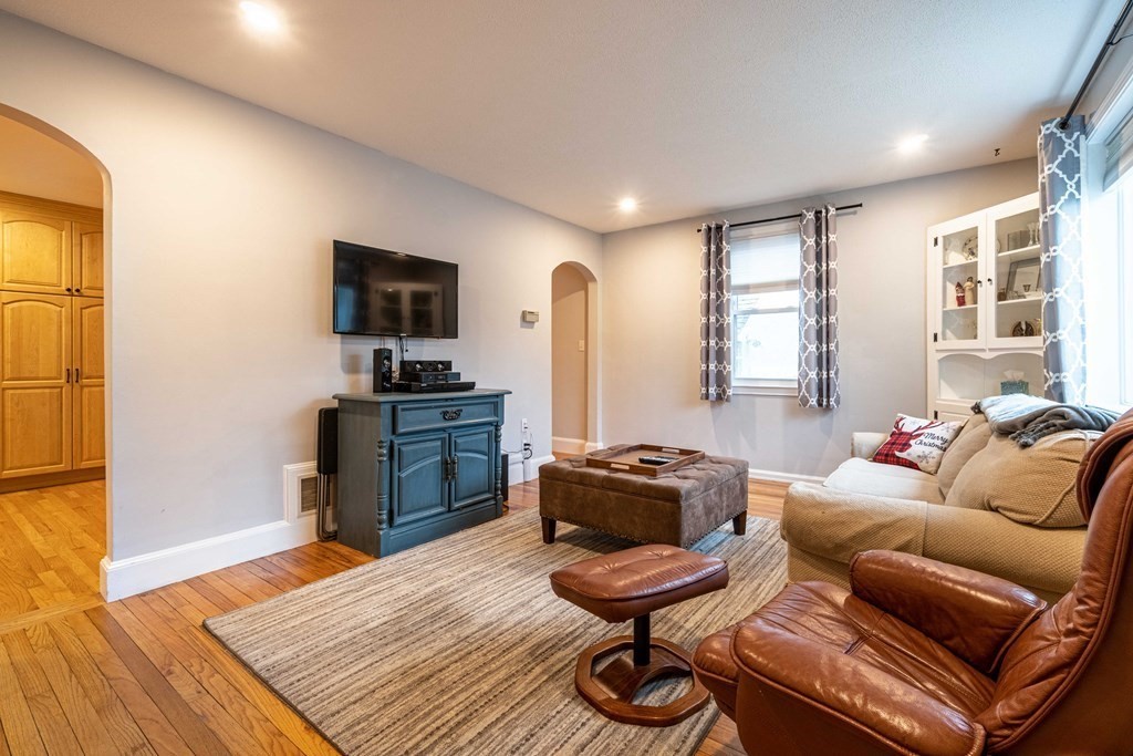 36 Sylvester Road Natick, MA 01760 - Photo 4 of 30 a living room with furniture and a flat screen tv