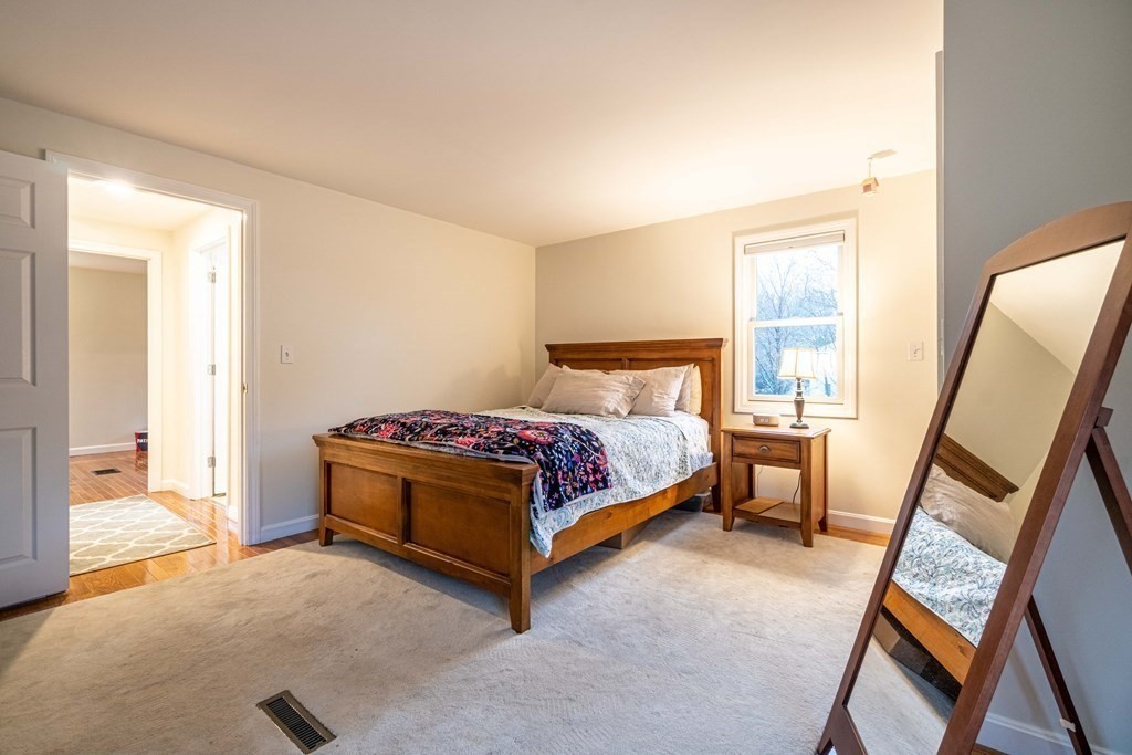 36 Sylvester Road Natick, MA 01760 - Photo 10 of 30 a bedroom with a bed and a dresser next to a window
