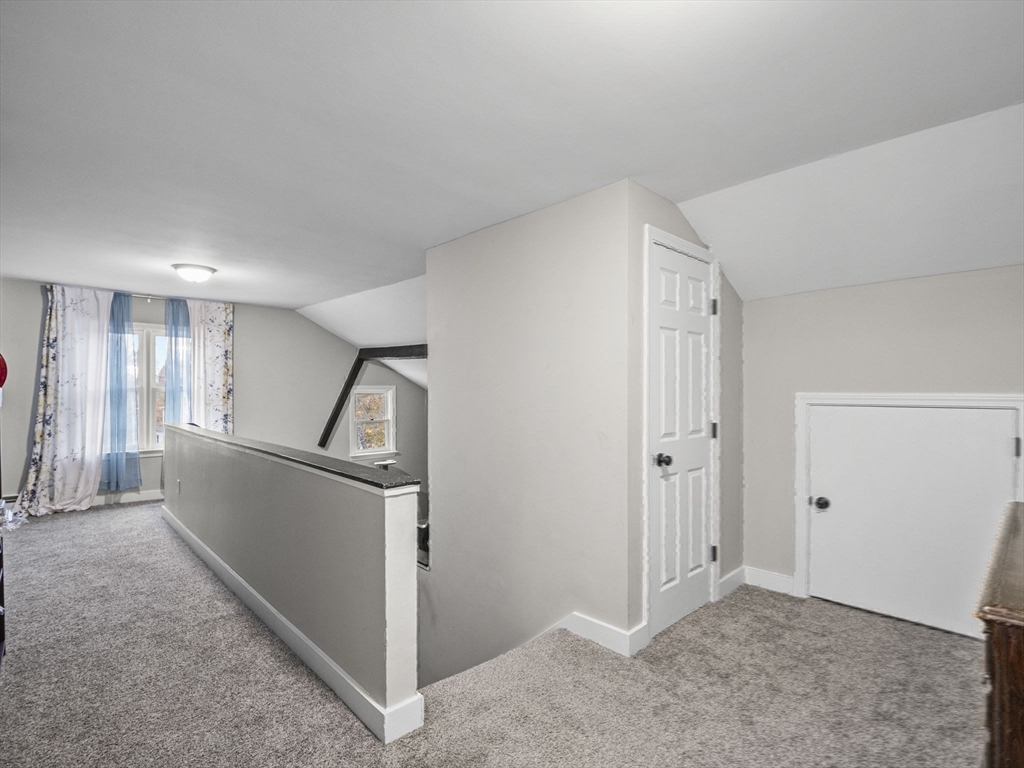 35 Cedar Street, Unit 6 Gardner, MA 01440 - Photo 12 of 33 a view of hallway with cabinet and stairs