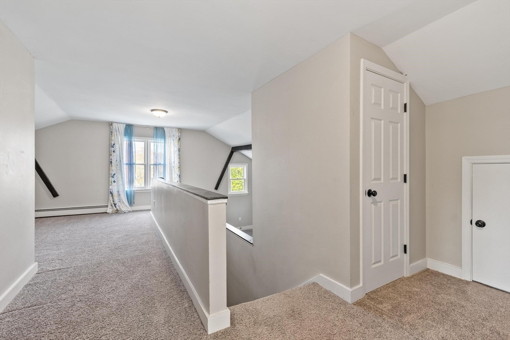 35 Cedar Street, Unit 6 Gardner, MA 01440 - Photo 13 of 33 a view of livingroom with hardwood floor and staircase