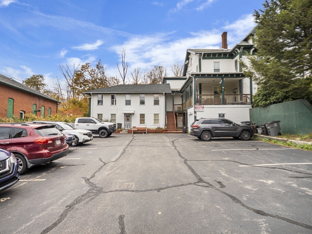 35 Cedar Street, Unit 6 Gardner, MA 01440 - Photo 32 of 33 a cars parked in front of a building