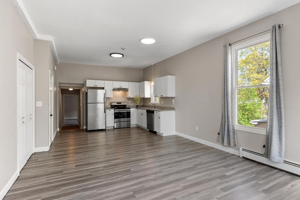 35 Cedar Street, Unit 6 Gardner, MA 01440 - Photo 5 of 33 a view of a kitchen with wooden floor