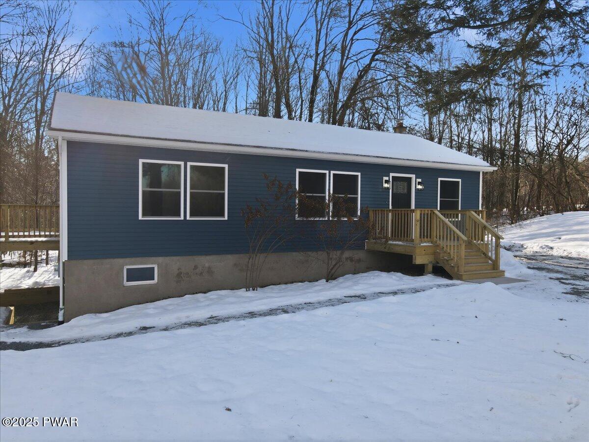 10 Swingle Road Moscow, PA 18444 - Photo 2 of 60 a view of a house with a yard covered in snow