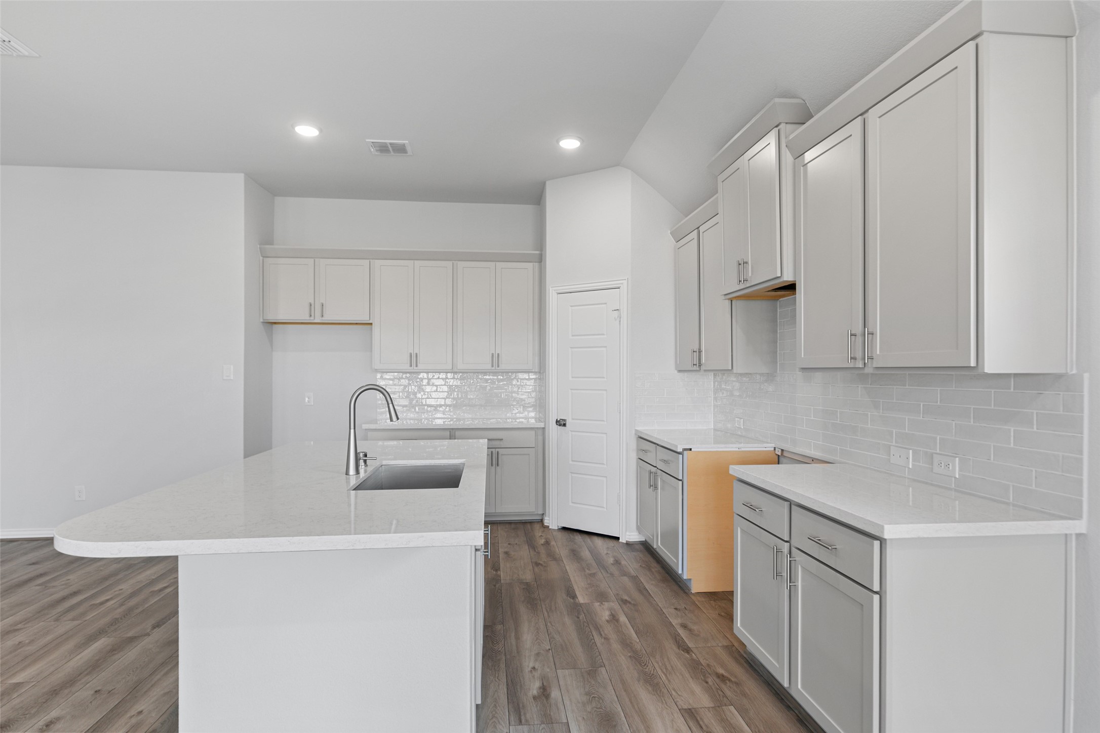 803 Evergreen Frst Lane Rosharon, TX 77583 - Photo 19 of 31 a kitchen with white cabinets and stainless steel appliances