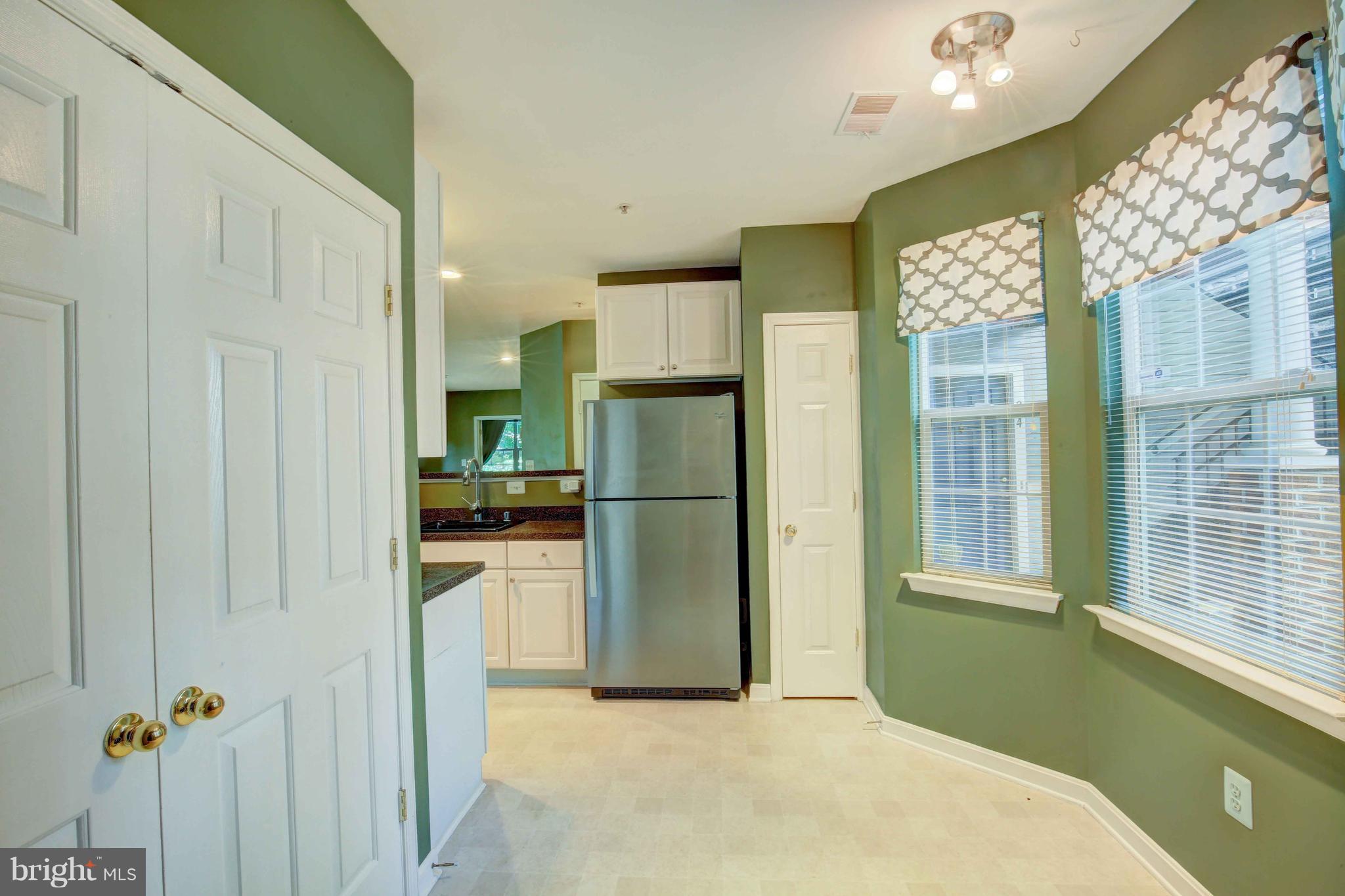 32 Hawk Rise Lane, Unit 102 Owings Mills, MD 21117 - Photo 11 of 34 View of Dining area w/washer /dryer to left