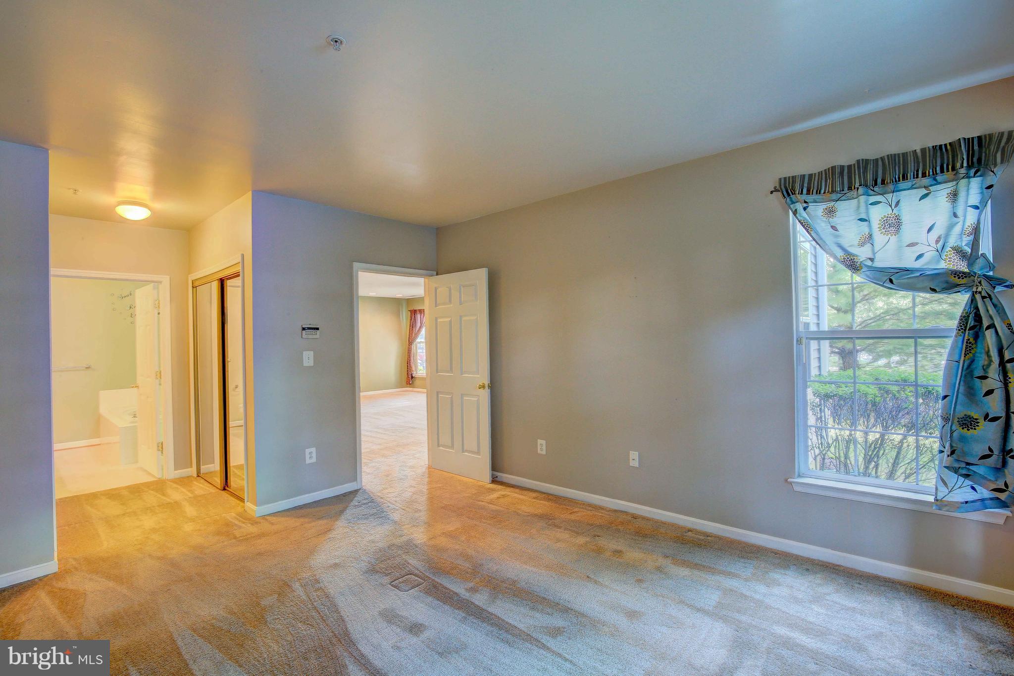 32 Hawk Rise Lane, Unit 102 Owings Mills, MD 21117 - Photo 21 of 34 Master bedroom view and bathroom