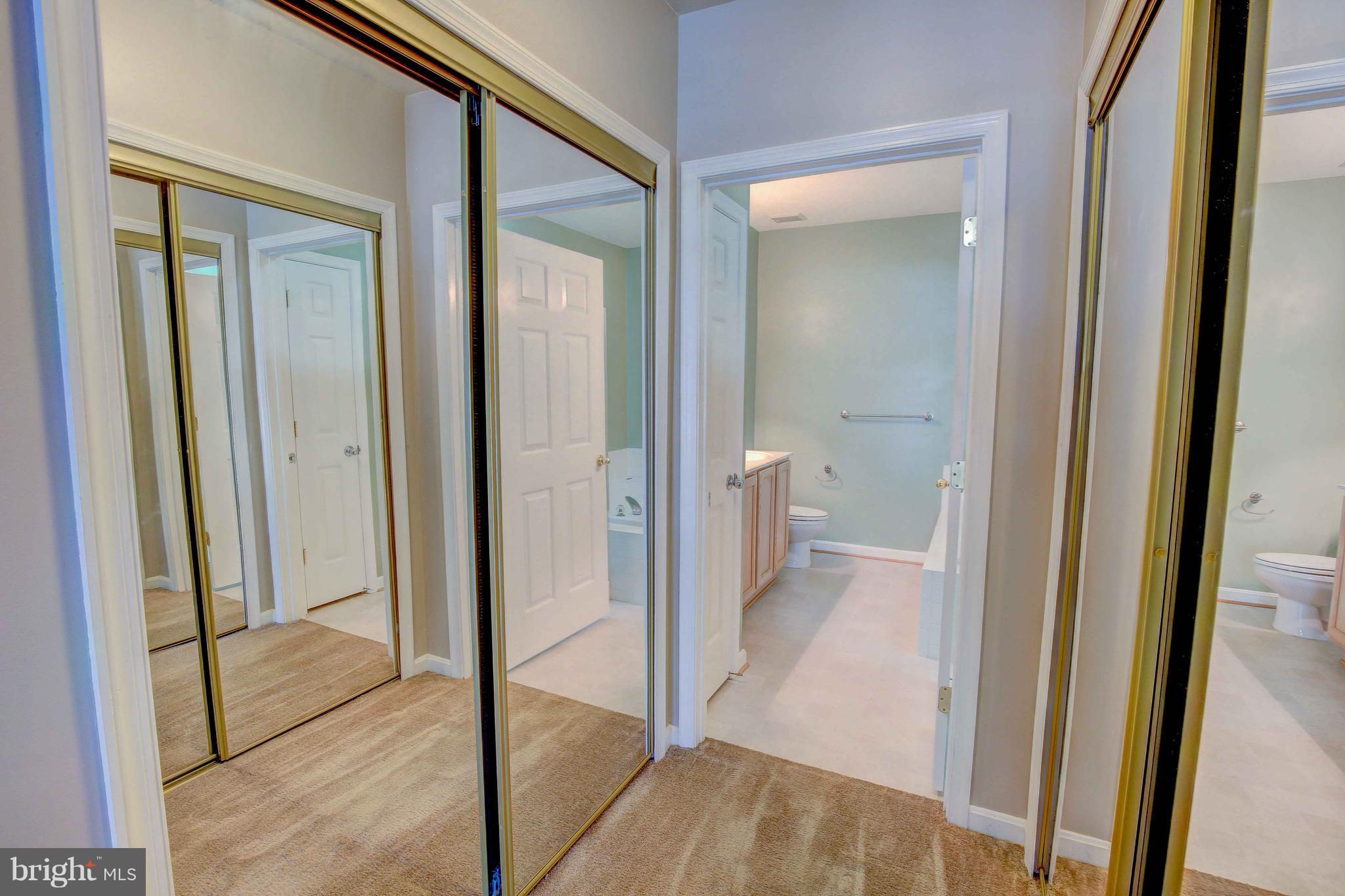 32 Hawk Rise Lane, Unit 102 Owings Mills, MD 21117 - Photo 22 of 34 Master Closet and bathroom view