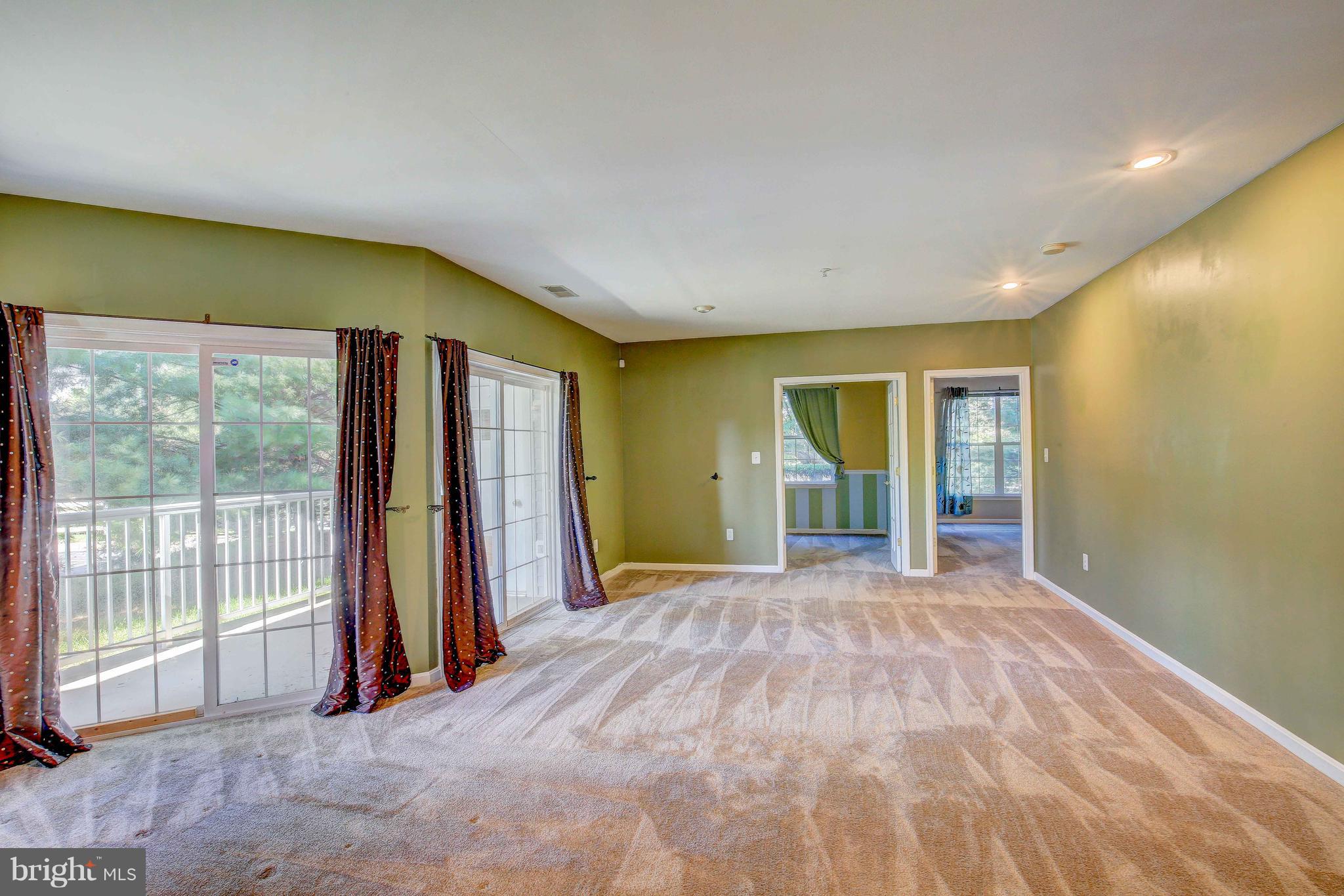 32 Hawk Rise Lane, Unit 102 Owings Mills, MD 21117 - Photo 7 of 34 Living Room/Den and Walk Out Patio
