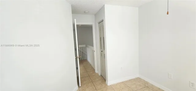 a view of a room with white door