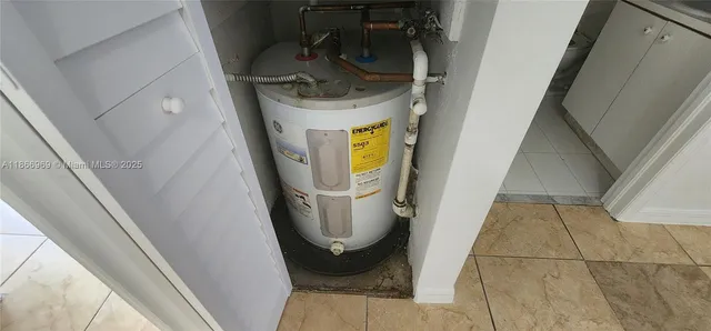 a bathroom with a light fixture and a mirror