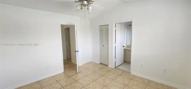 a view of a house with a small yard and plants