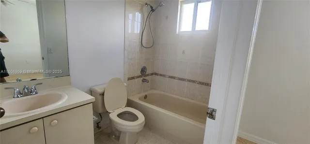 a view of a lake with houses in the back