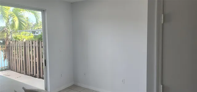 a kitchen with a refrigerator and a sink