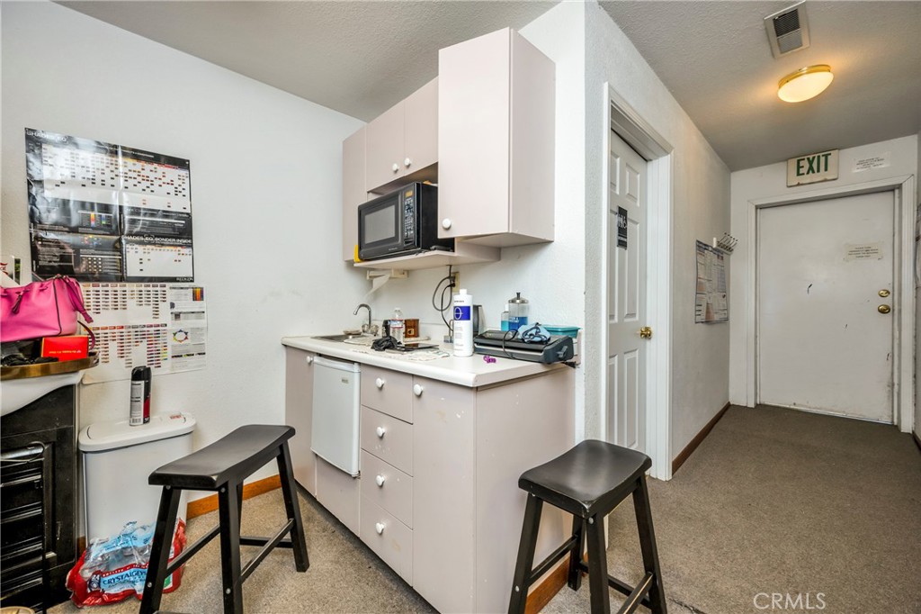 21130 Calistoga Road Middletown, CA 95461 - Photo 19 of 25 a kitchen with stainless steel appliances a sink cabinets and a window