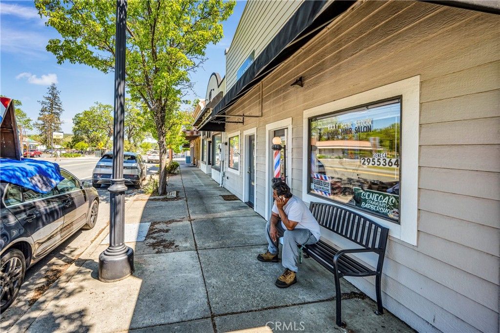 21130 Calistoga Road Middletown, CA 95461 - Photo 8 of 25 a view of a porch with furniture and floor to ceiling window