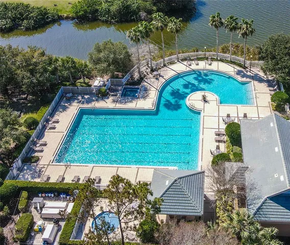an aerial view of a house with outdoor space swimming pool and outdoor seating