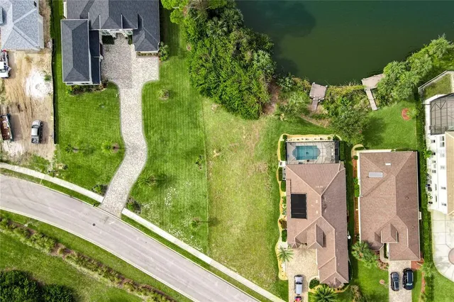 an aerial view of residential house with outdoor space and parking