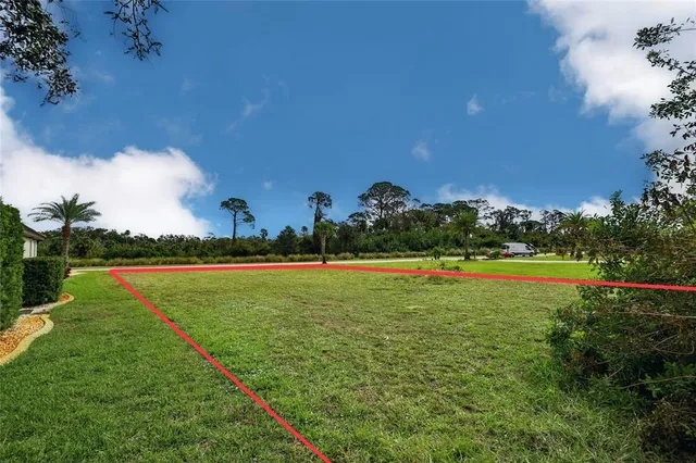 a view of a golf course with a lake