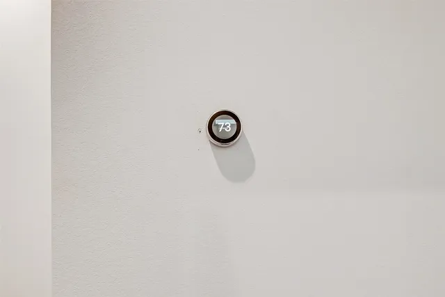 a backyard of a house with wooden floor and outdoor seating