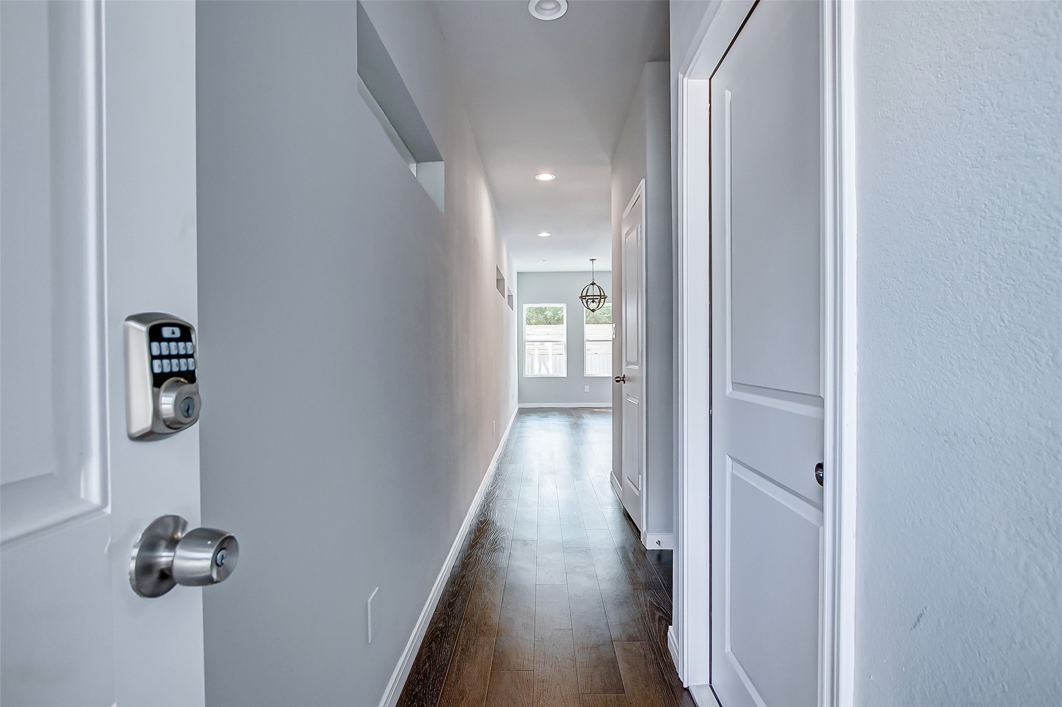 4915 Paradigm Ln Spring Spring, TX 77379 - Photo 3 of 20 a view of a hallway with wooden floor