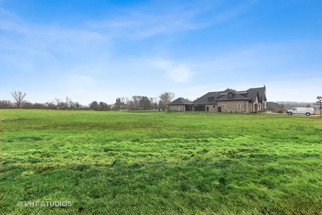 a view of a green field with clear sky