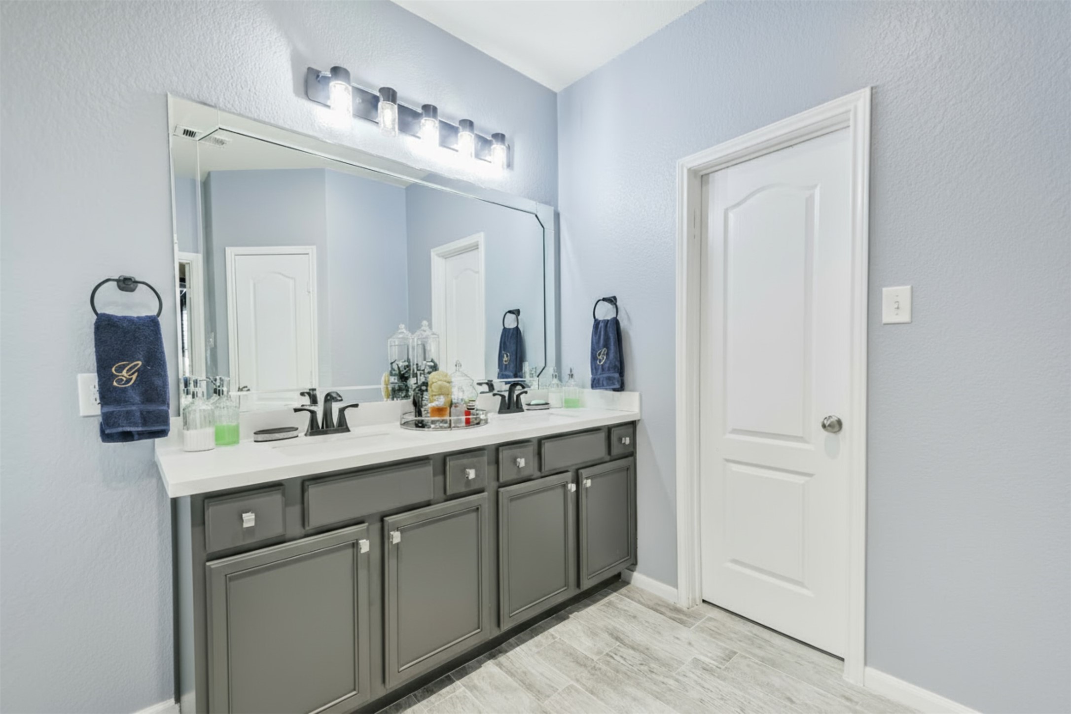 24047 Schults Meadow Lane Spring, TX 77389 - Photo 26 of 47 a bathroom with a double vanity sink and a mirror