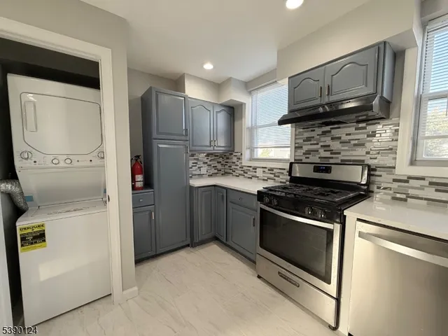 a kitchen with a stove microwave and refrigerator