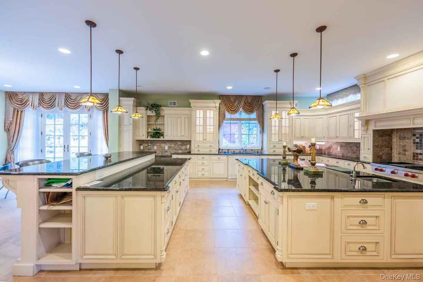 5 Westgate Road Muttontown, NY 11791 - Photo 17 of 42 a kitchen with stainless steel appliances granite countertop a stove a sink and a refrigerator