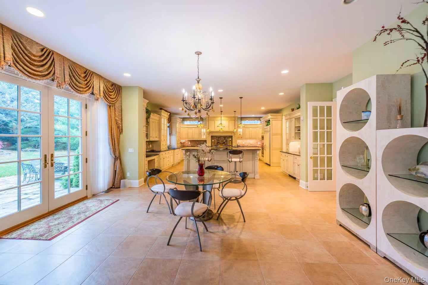 5 Westgate Road Muttontown, NY 11791 - Photo 20 of 42 a view of a dining room with furniture and chandelier