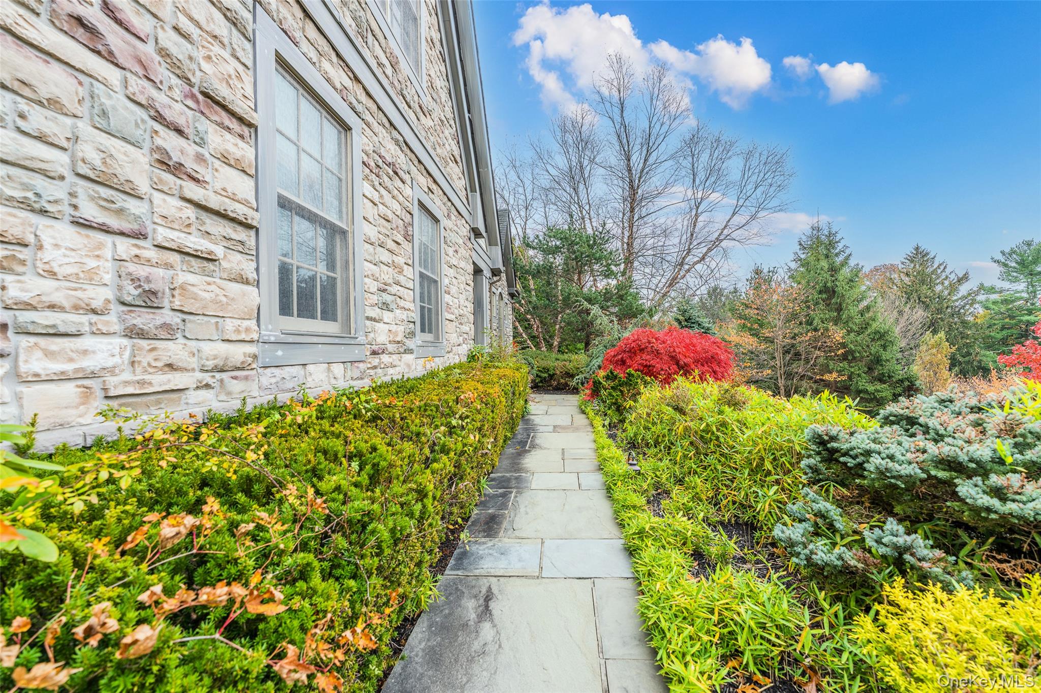 5 Westgate Road Muttontown, NY 11791 - Photo 27 of 42 a view of a pathway with flower plants