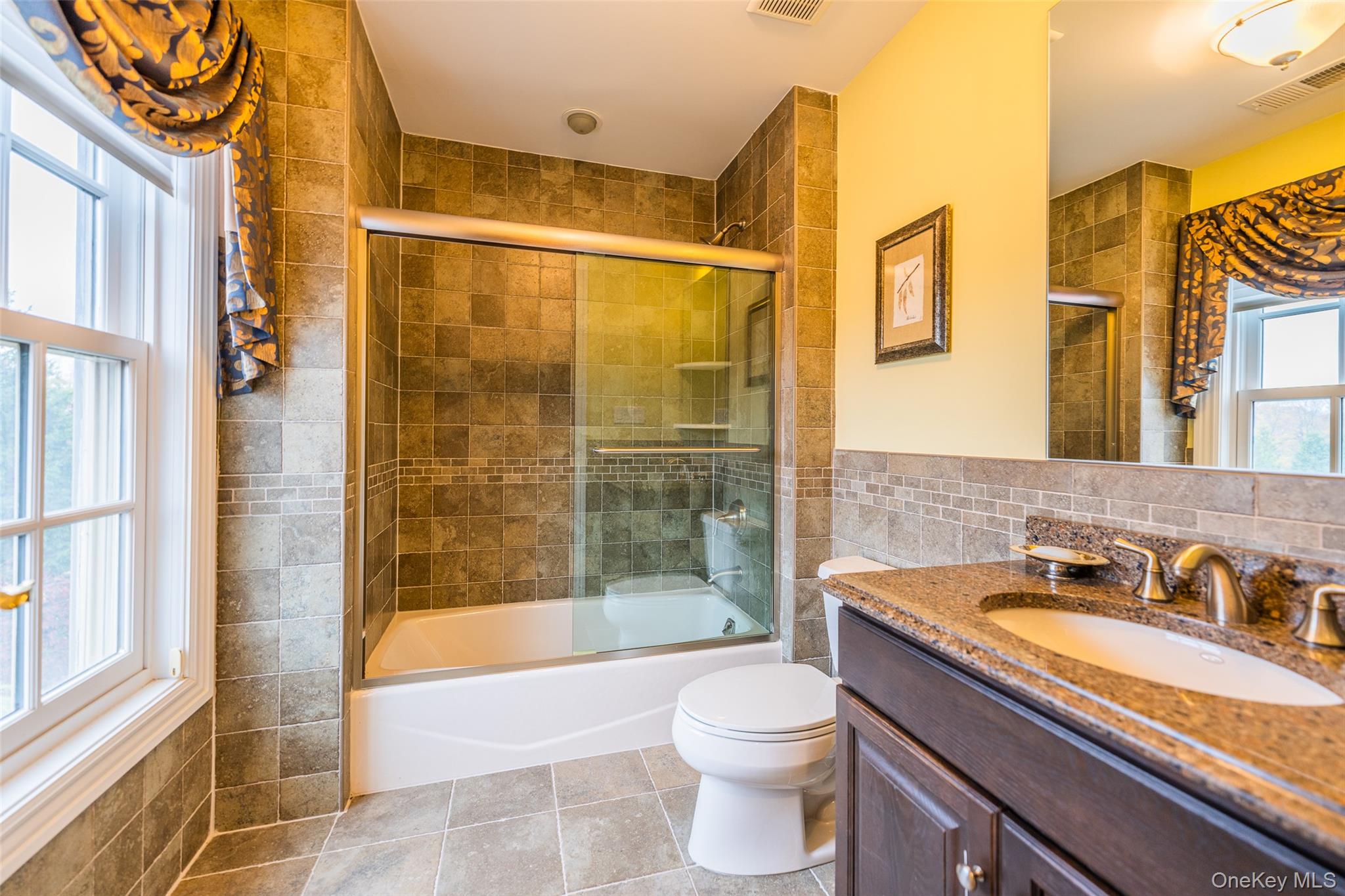 5 Westgate Road Muttontown, NY 11791 - Photo 33 of 42 a bathroom with a granite countertop sink toilet and shower