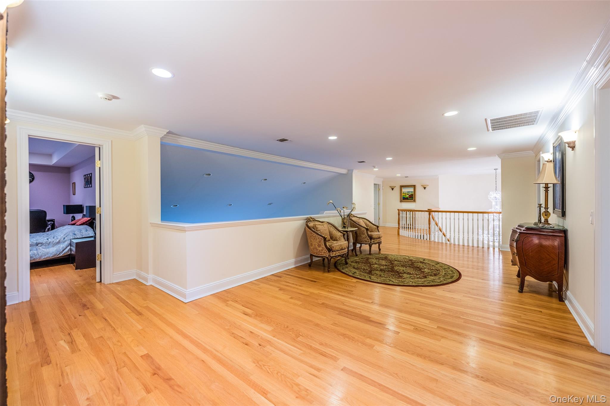 5 Westgate Road Muttontown, NY 11791 - Photo 36 of 42 a large room with a large window and furniture